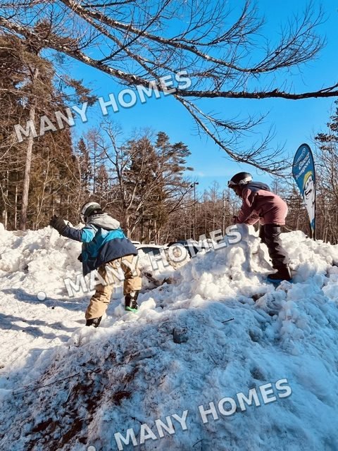A family enjoying a snowy winter walk.
